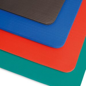All of the Sissel gym mats are stacked one on top of the other in a staggered way so you can see the colour and texture of each one clearly. The bottom mat is green then red, blue, black.