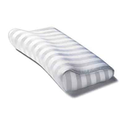 Sissel Deluxe Orthopaedic Pillow side on. You can see the stipes on the cover that is contoured to the shape of the pillow. The darker areas of the stripes are whre the material is silkier. This pillow has a side that is raised to fit the contour of your neck whether you are lying on your back or side and the rest of the pillow is relatively flat.