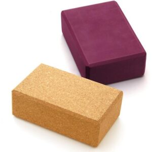 Both of the yoga blocks available to buy on sittingwell. The one on the bottom is made from cork and the one above is a maroon red colour. Both of them are the same brick shape.