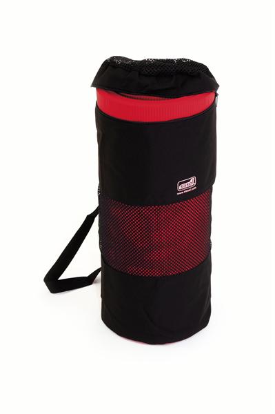 The gym mat bag is black material. It is zipped around the top, has a black carry handle and on the right hand side mid way up is the Sissel logo in white. This particular bag has a red gym mat rolled up inside.