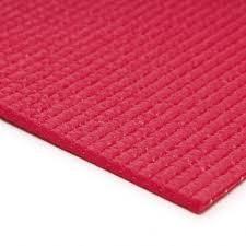 A zoomed in image of a fushia sissel yoga mat. You can see that is has a slightly bobbled textured surface to help with grip.