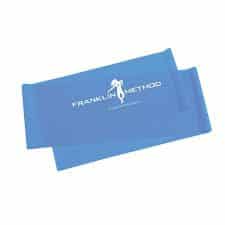 A Franklin method blue resistance band folded over on itself. In white are the words franklin method and there is the image is a lady dancing also in white.