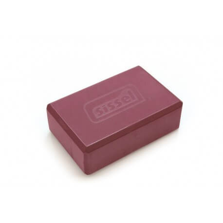 A Sissel foam yoga block, it is red. Embossed on it is the word Sissel. It is brick shaped and the edges are slightly bevelled if that is the correct term so that the edges are softened.